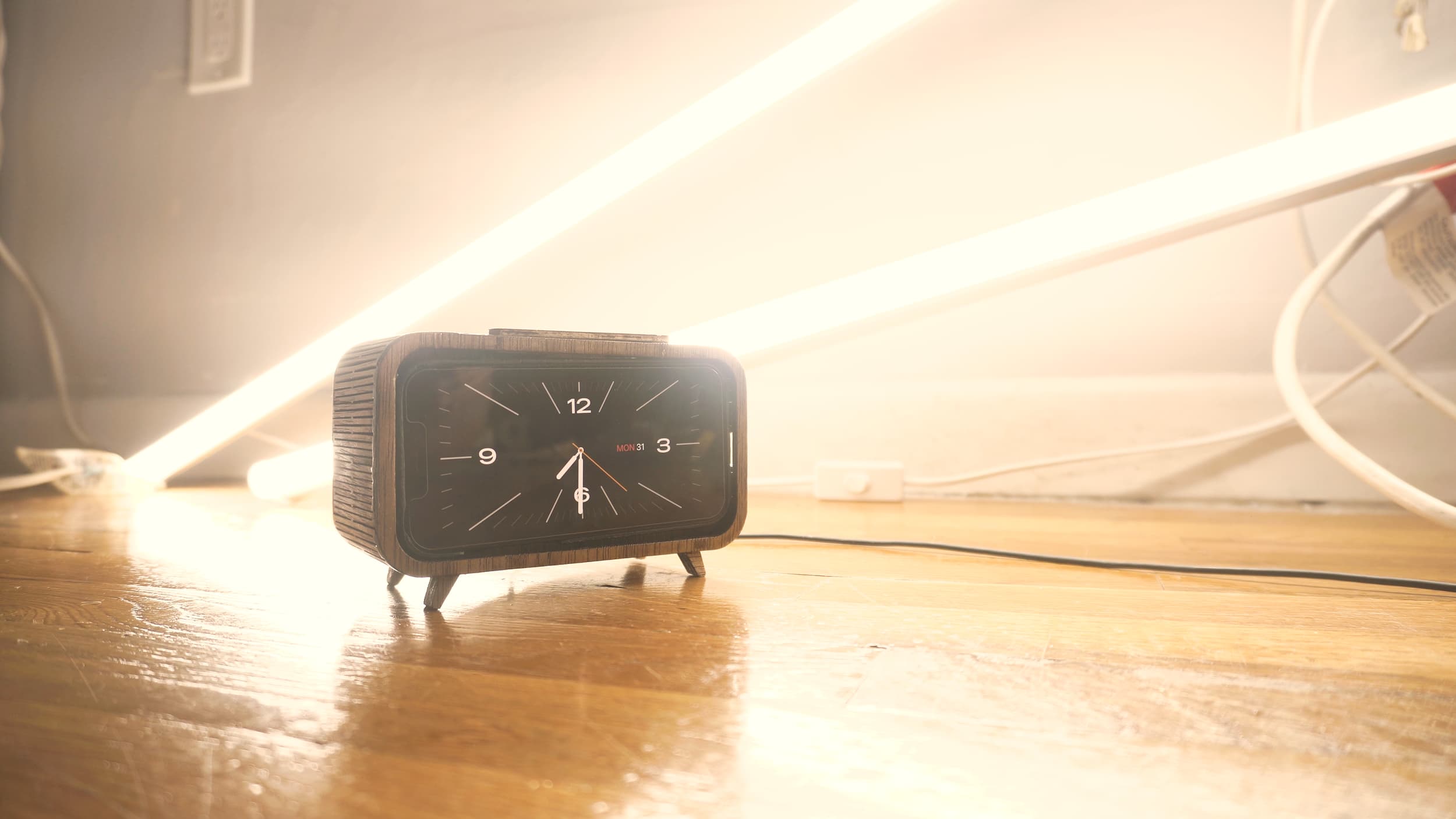 A retro wooden clock to house my iPhone. I utilized a magnetic (magsafe) charger to hold the phone in place. The iPhone has a neat feature of turning into a clock when charging and horizontally oriented. The snooze button! A video of this design + build is on the Pinewood Slurpy channel.