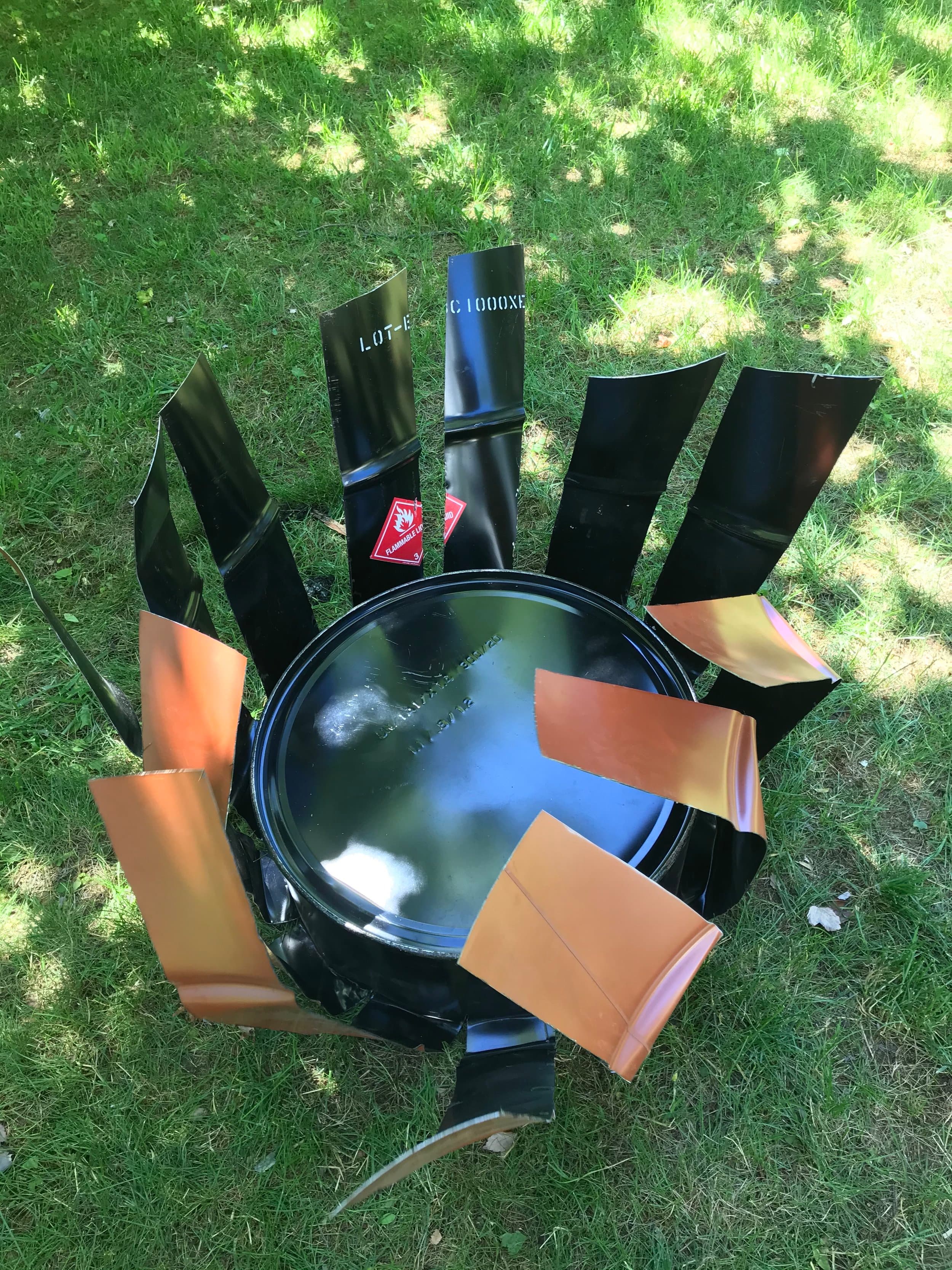 I folded each section back and underneath the bottom of the oil drum.