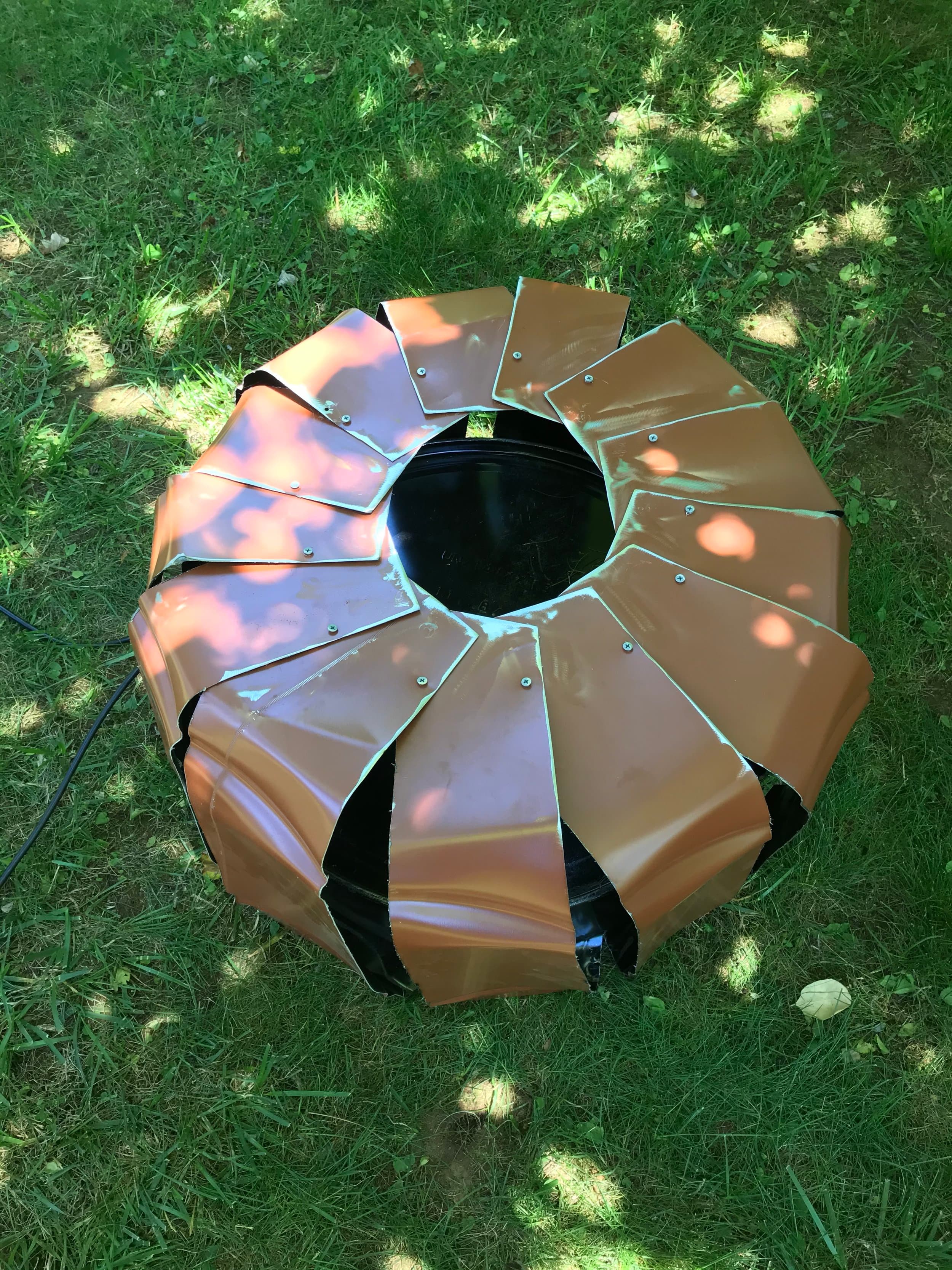 I then overlapped each section and fastened them together, and smoothed the edges with the angle grinder.